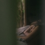 Sad woman lay in bed