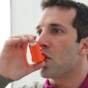 Man using inhaler