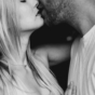 Couple leaning in for a kiss