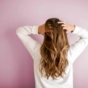 Woman running hands through her hair