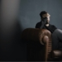 Stressed man in armchair