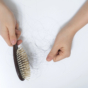 Hair being pulled from brush